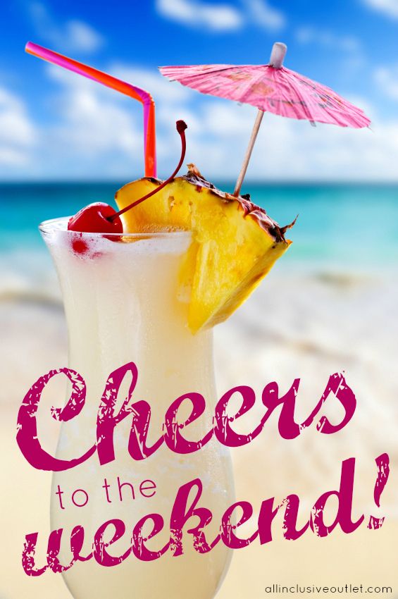 Pina colada drink in cocktail glass with tropical beach in background